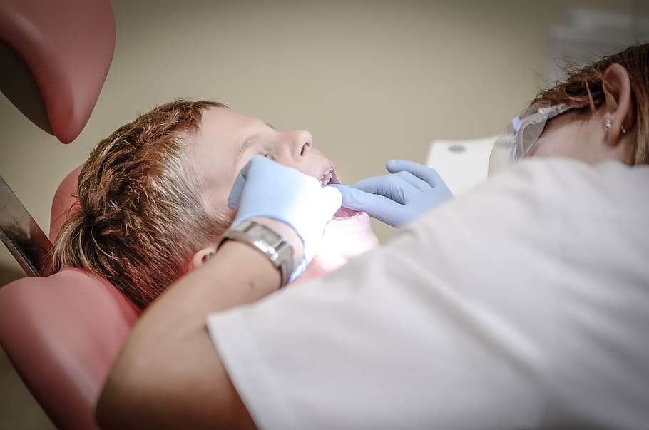 boy check up dental care dentist